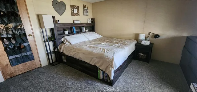 a bed sitting in a room next to a window