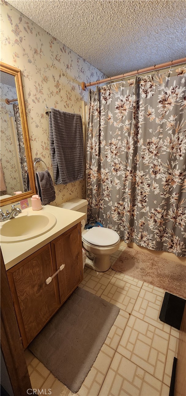 3589 West Wells Road, Unit 99 Blythe, CA 92225 - Photo 9 of 27 a bathroom with a sink toilet and shower