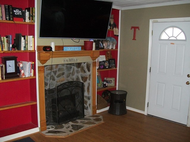 168 Liberty Ridge Drive Gray, GA 31032 - Photo 2 of 22 a living room with furniture and a fireplace