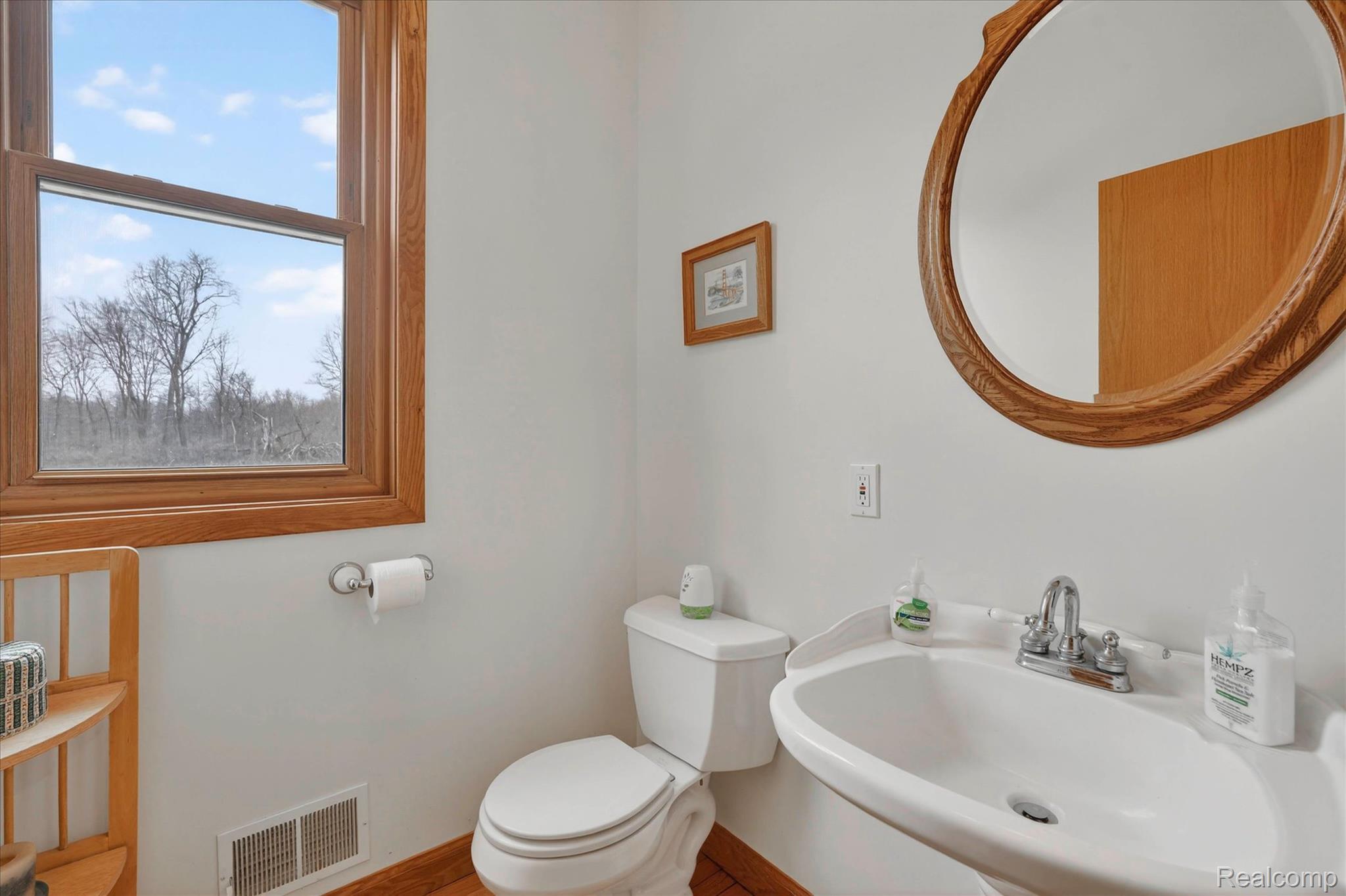 5640 Fisher Road Howell, MI 48855 - Photo 11 of 66 Half bathroom with toilet and a sink