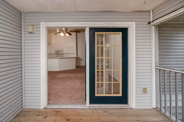 a view of a door and a window