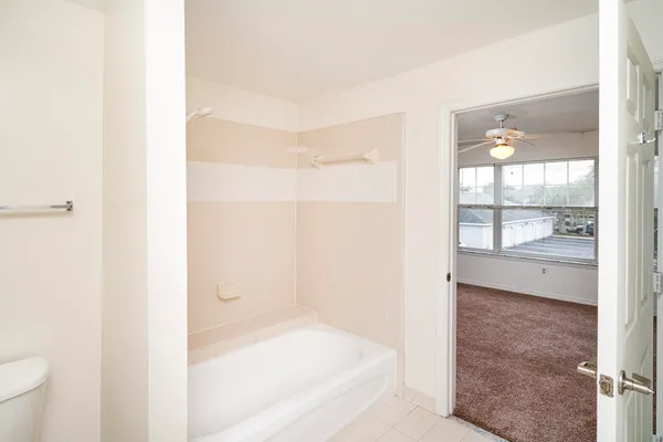 a bathroom with a bathtub and shower