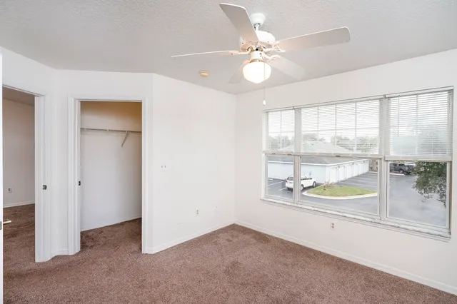 an empty room with fan