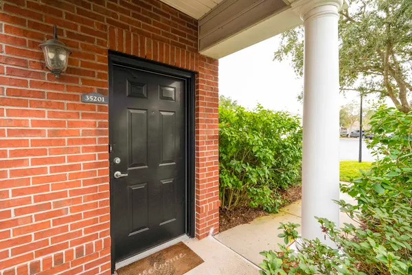 a view of a door and a street view