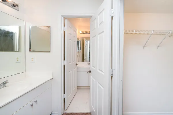 a bathroom with a sink and mirror