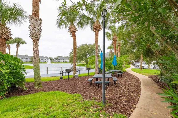 a view of a park with a table and chairs
