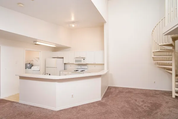 a utility room with a sink washer and dryer
