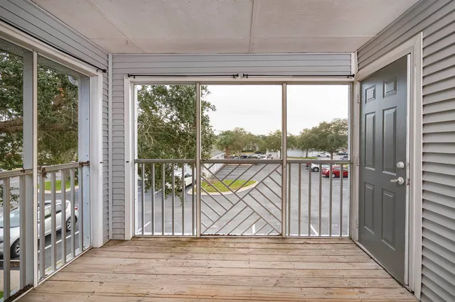 a view of a balcony with wooden floor
