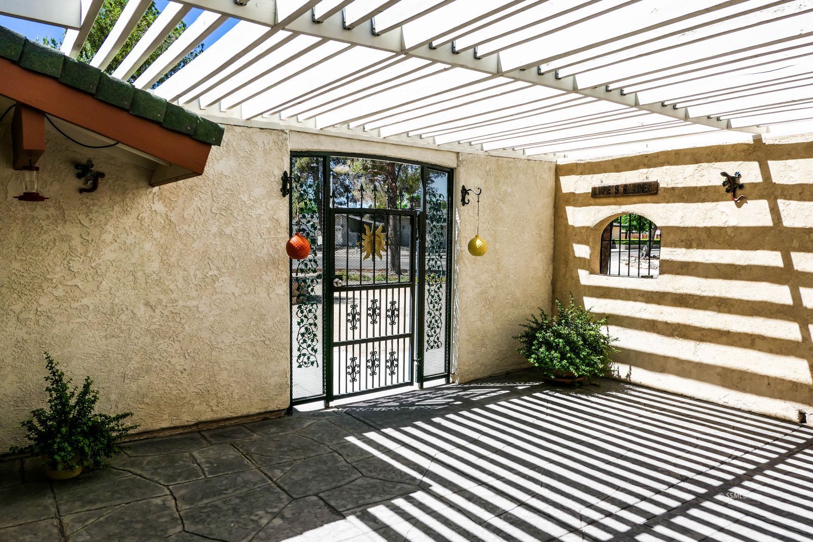 532 West Howell Avenue Ridgecrest, CA 93555 - Photo 5 of 44 a view of a porch with a table and chairs and potted plants