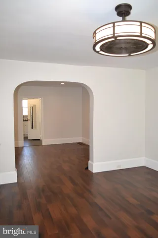 a view of hallway with wooden floor