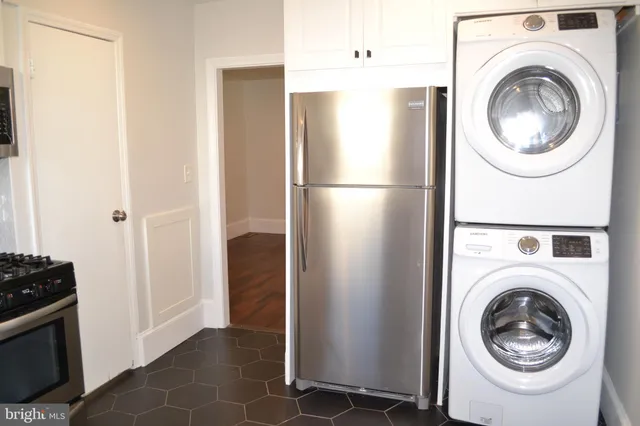 a kitchen with a sink stove and microwave