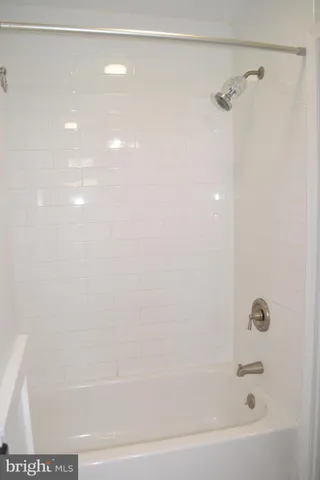 a kitchen with a sink a window and cabinets