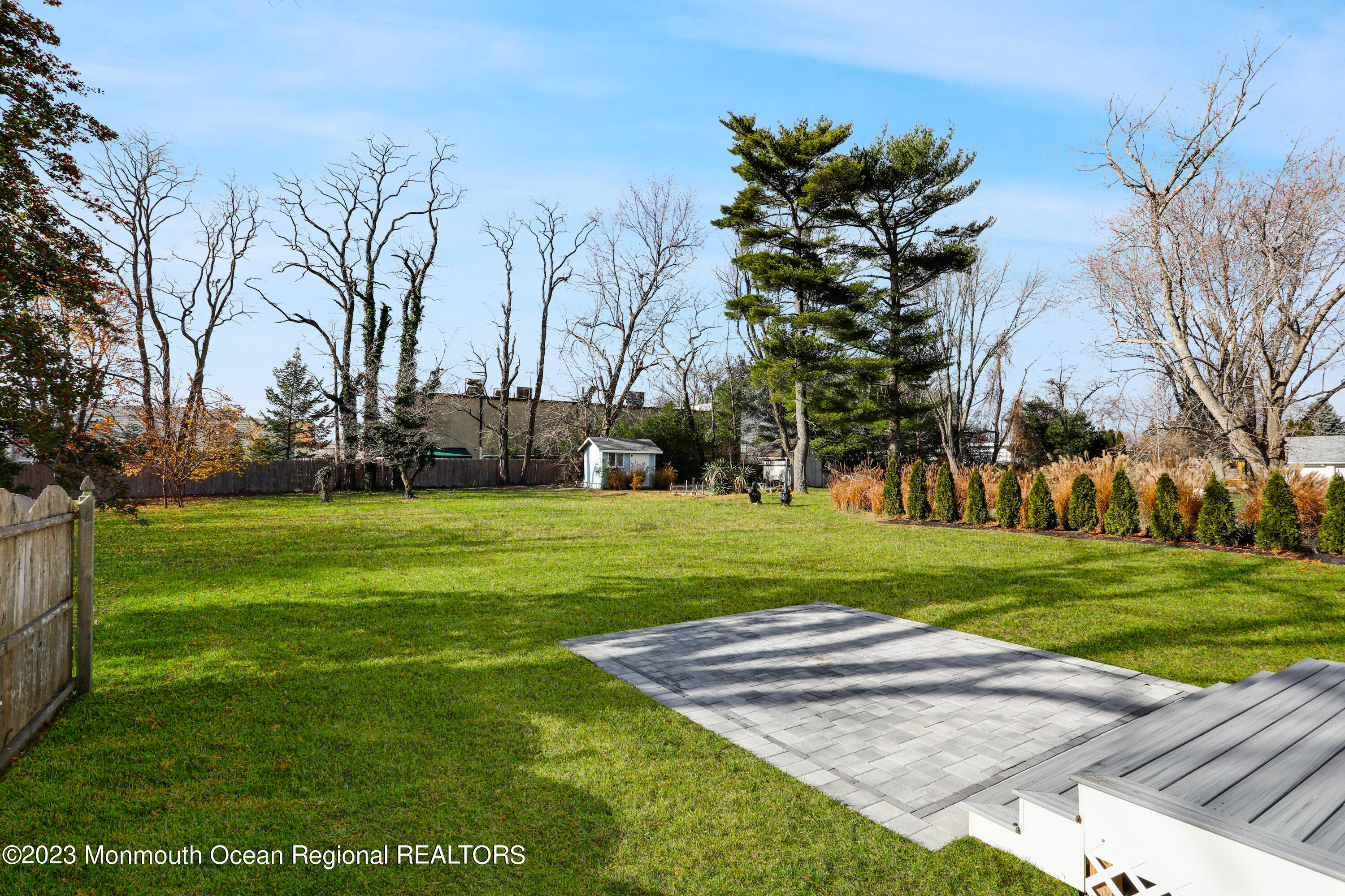 2223 Old Mill Road Spring Lake Heights, NJ 07762 - Photo 54 of 74 a garden with trees in front of it