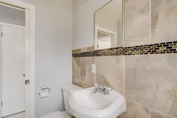 a bathroom with a sink a mirror and a shower