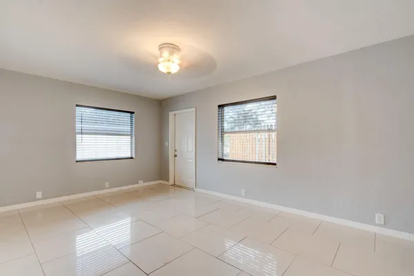 a view of an empty room with a window