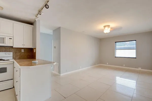 a view of cabinets and window