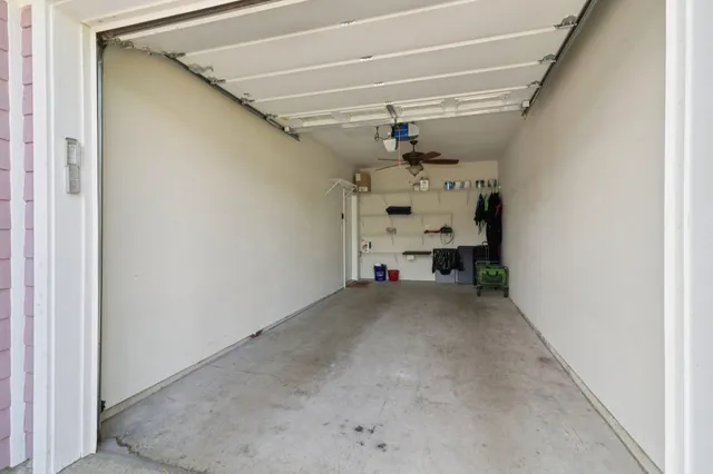 a view of a hallway with paintings on the wall