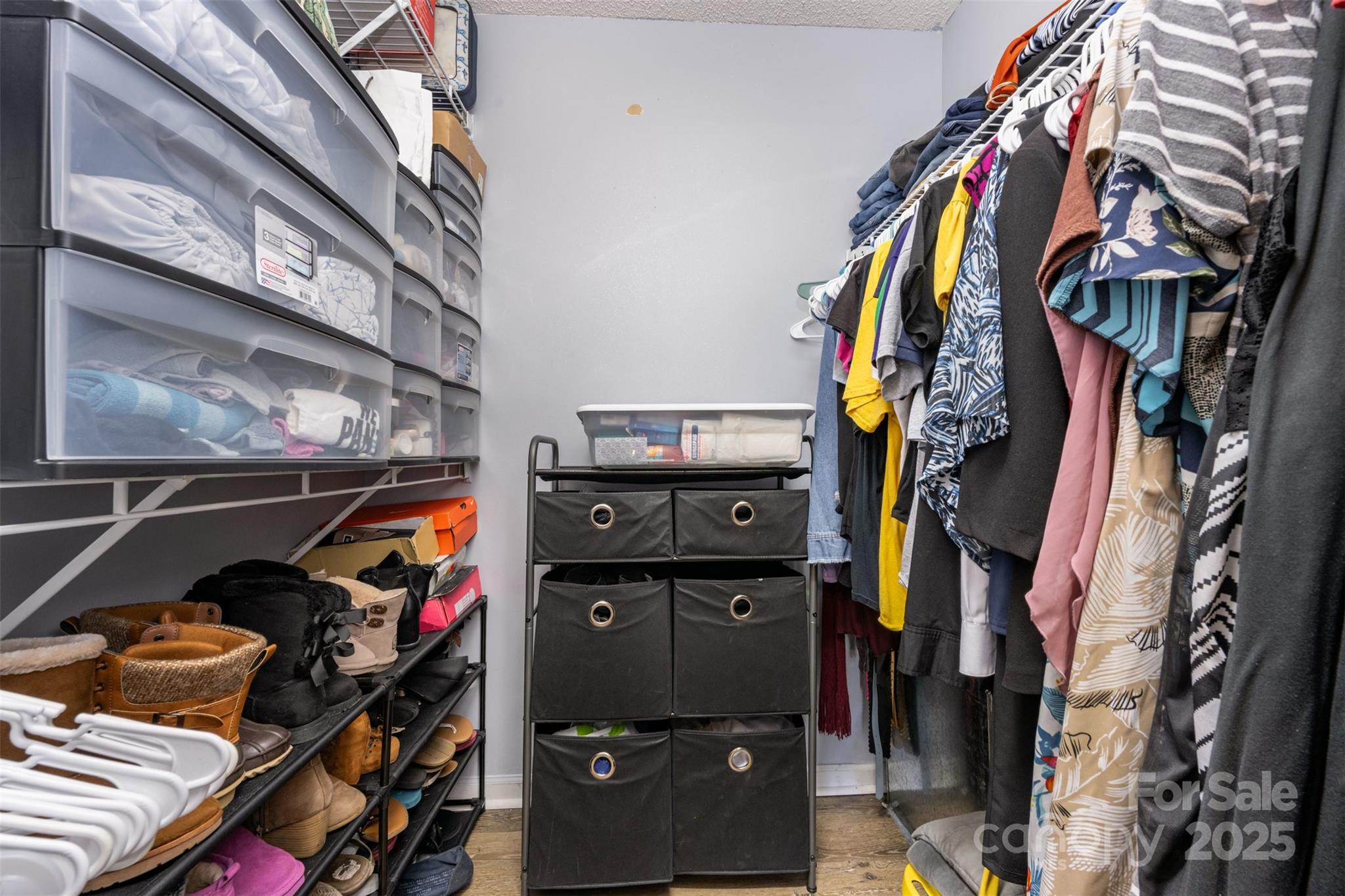 704 Willow Road Salisbury, NC 28147 - Photo 12 of 18 a view of walk in closet with clothes and shoes