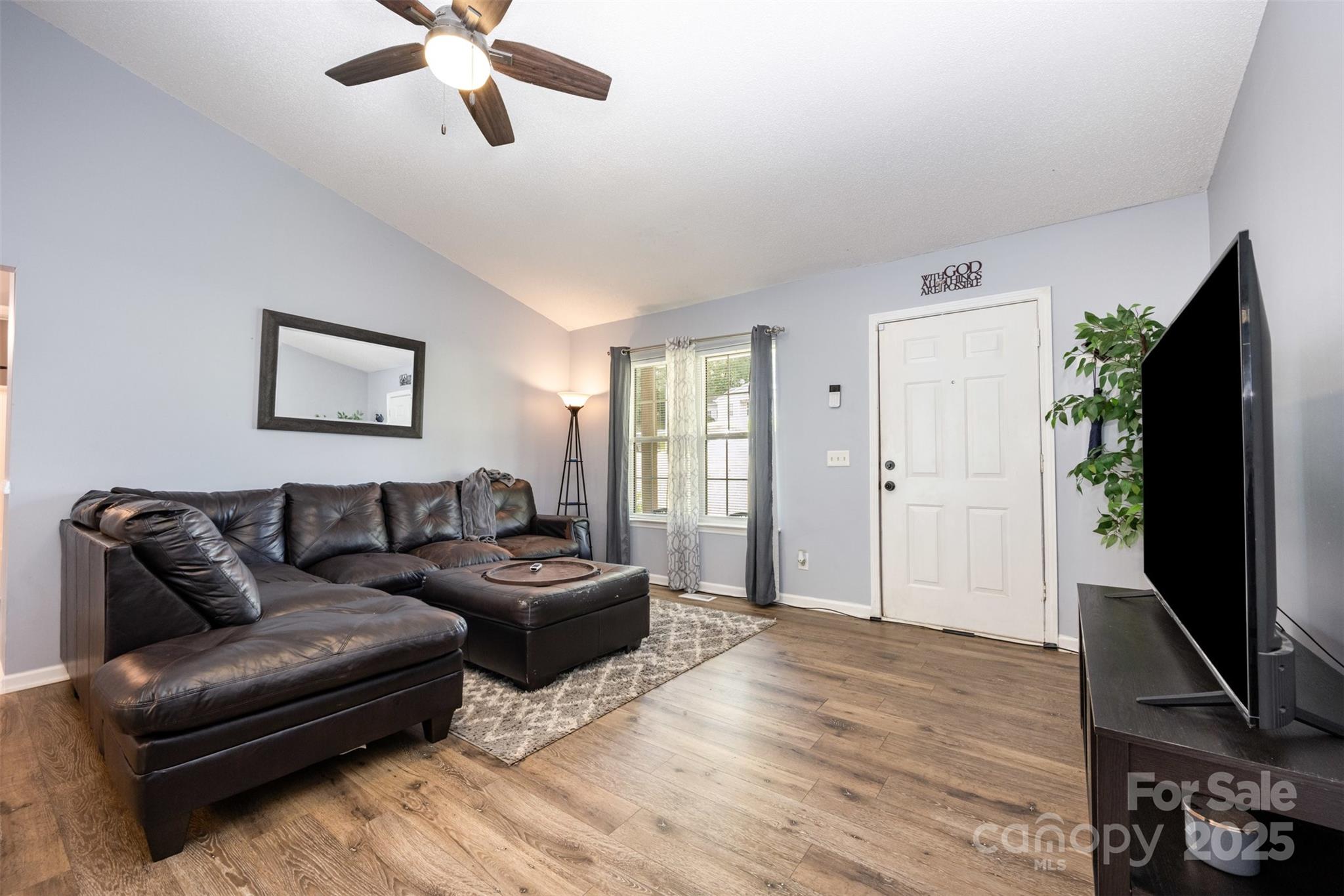 704 Willow Road Salisbury, NC 28147 - Photo 7 of 18 a living room with furniture flat screen tv and a window