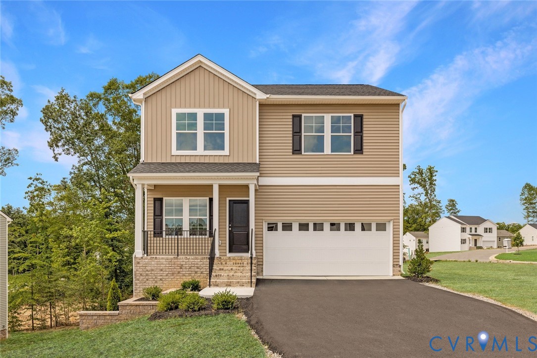 137 Bellevue Terrace Aylett, VA 23009 - Photo 1 of 24 a front view of a house with a yard and garage