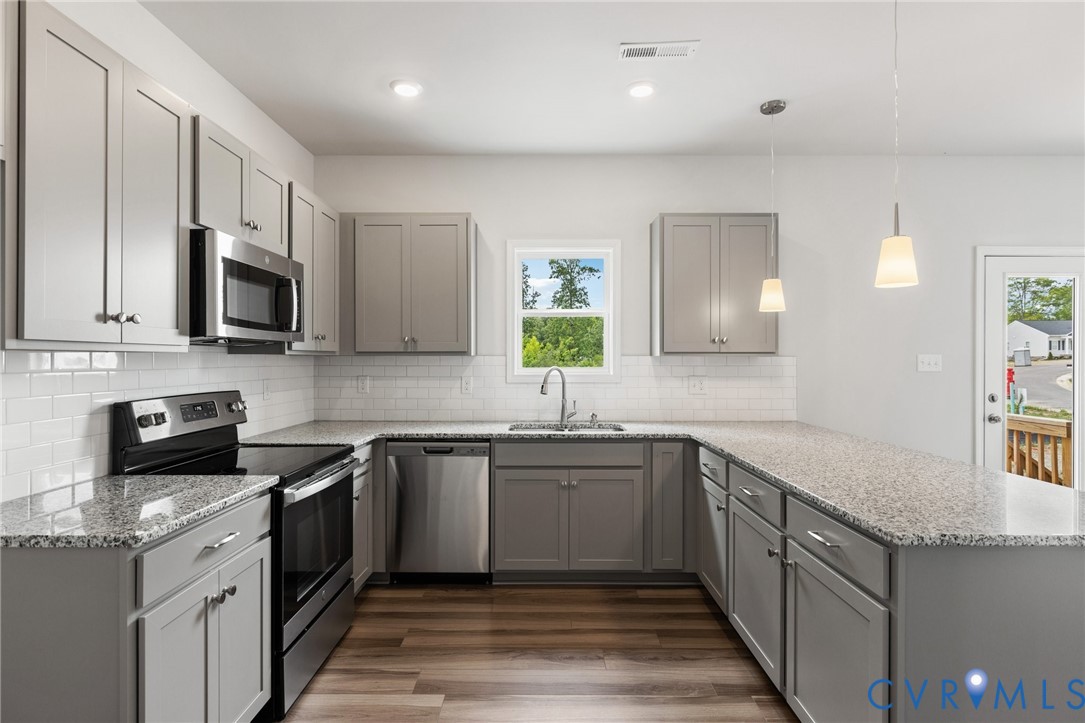137 Bellevue Terrace Aylett, VA 23009 - Photo 12 of 24 a kitchen with granite countertop sink stainless steel appliances and cabinets