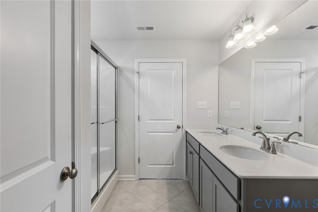 137 Bellevue Terrace Aylett, VA 23009 - Photo 17 of 24 a bathroom with a sink double vanity and a mirror