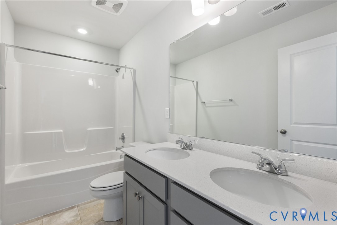 137 Bellevue Terrace Aylett, VA 23009 - Photo 20 of 24 a bathroom with a sink a toilet and shower