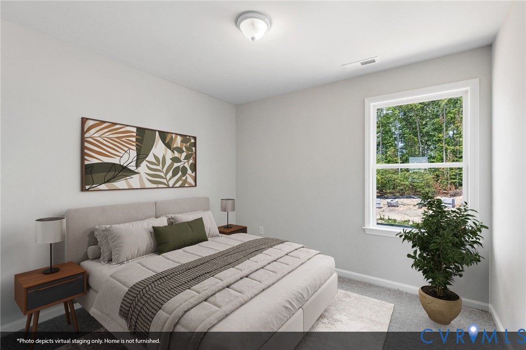 137 Bellevue Terrace Aylett, VA 23009 - Photo 5 of 24 a bedroom with a large bed and a potted plant
