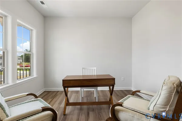 a living room with a couch and a window