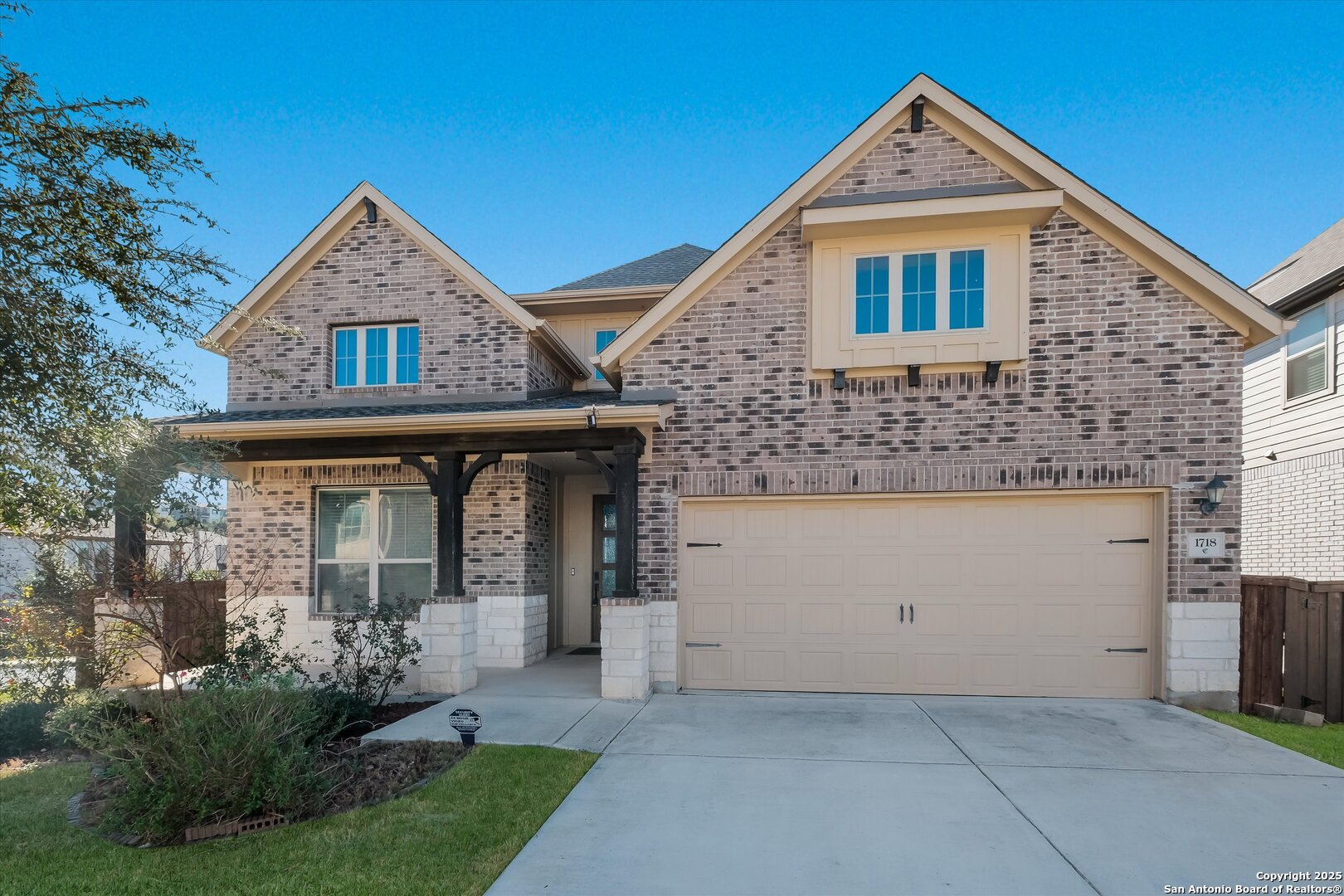 1718 Wind River San Antonio, TX 78258 - Photo 2 of 32 a front view of a house with garden