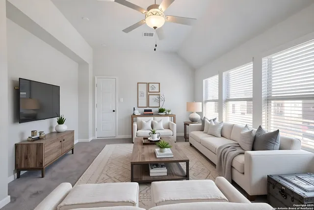 a living room with furniture and a flat screen tv