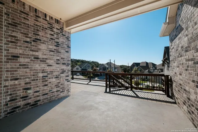 a view of a chairs and table in the parking area