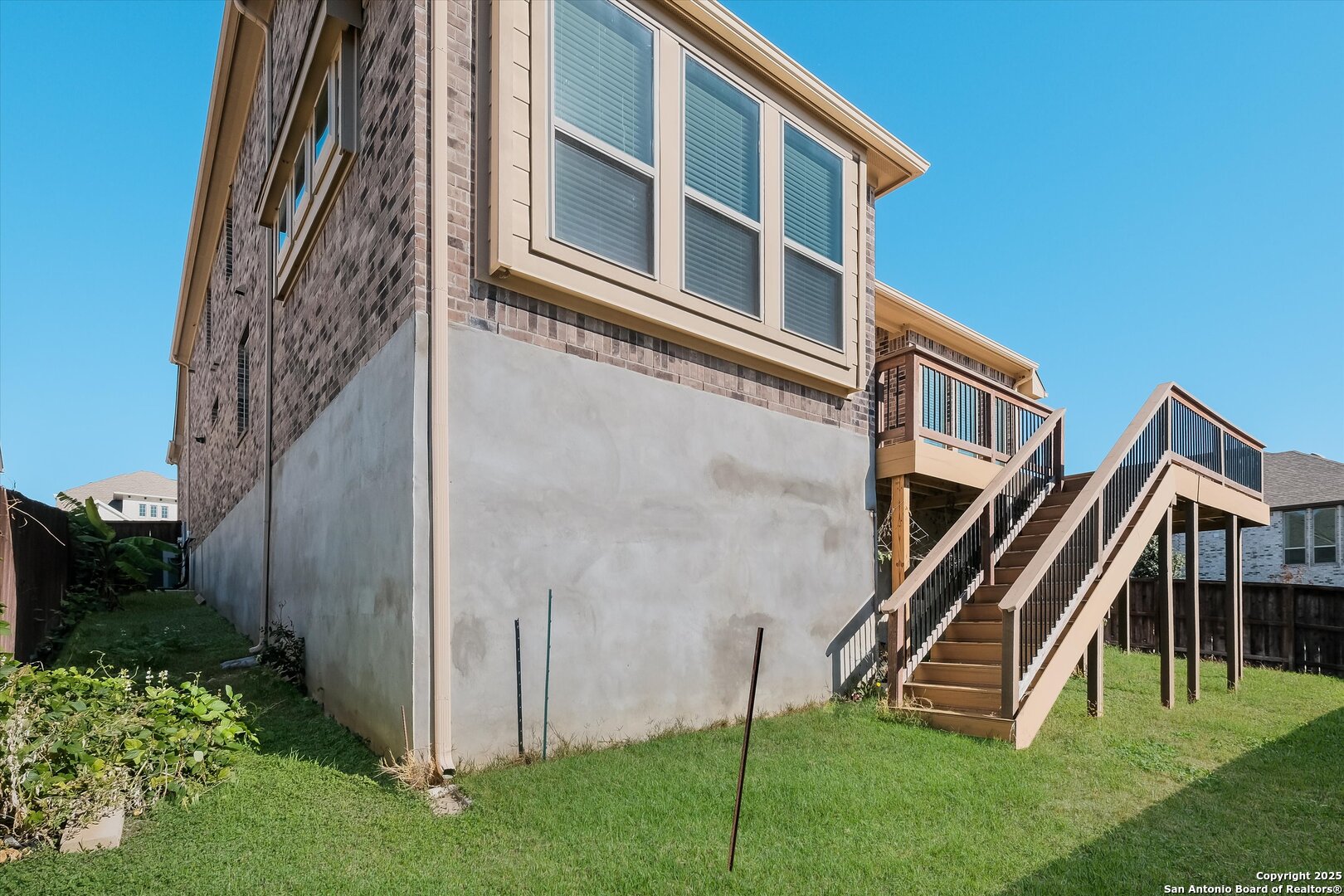 1718 Wind River San Antonio, TX 78258 - Photo 30 of 32 a front view of a house with a yard