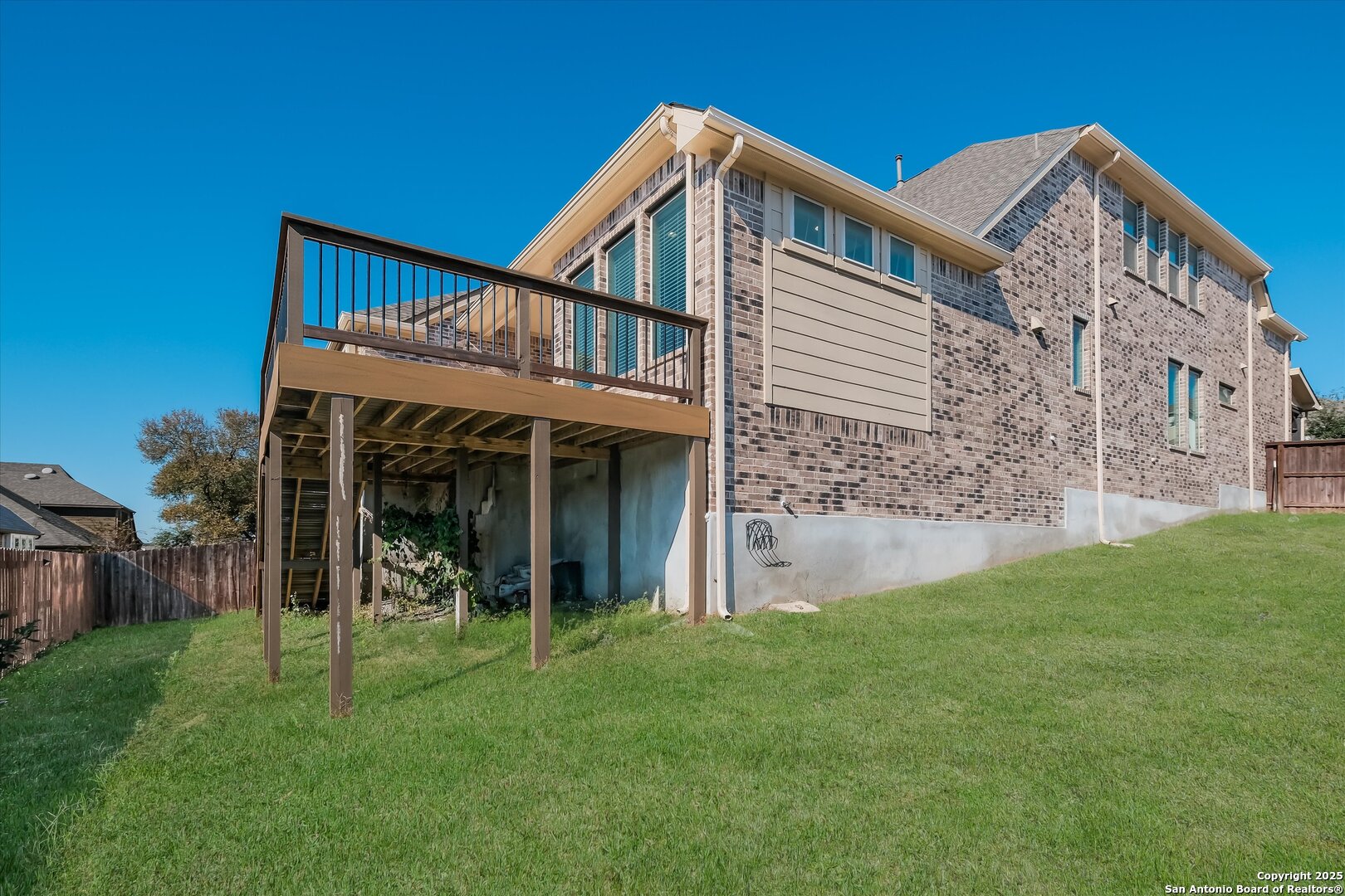 1718 Wind River San Antonio, TX 78258 - Photo 31 of 32 a front view of a house with a yard