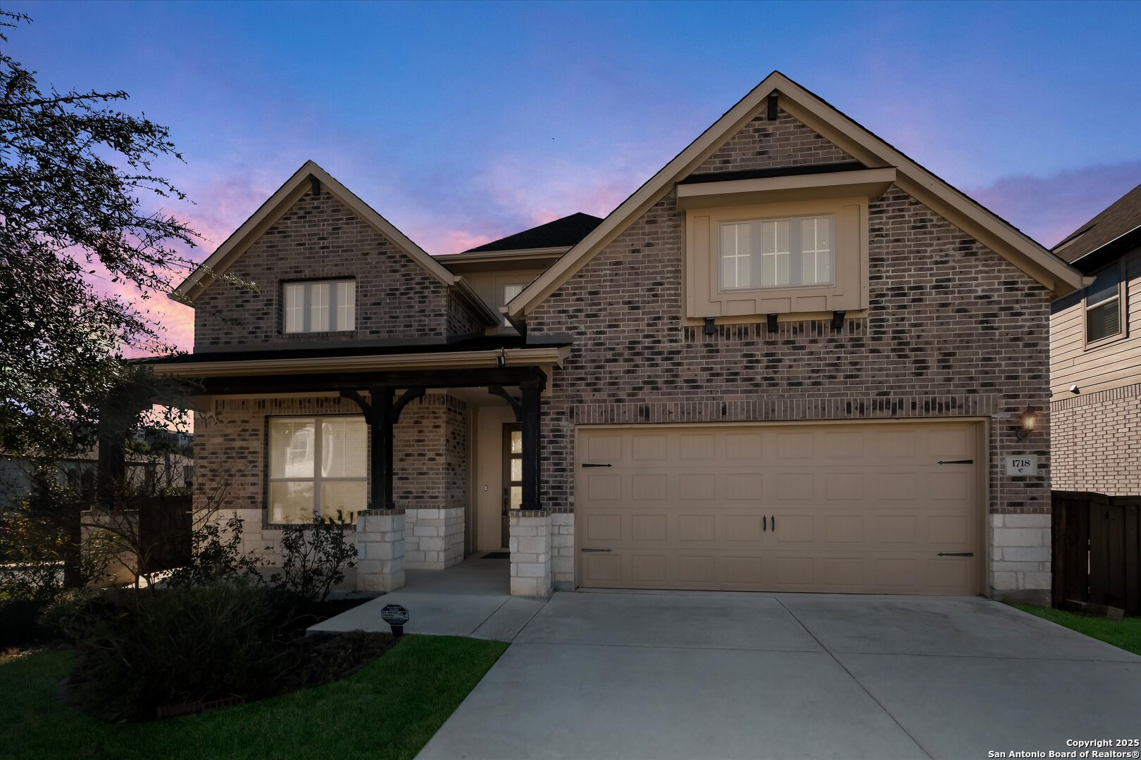 1718 Wind River San Antonio, TX 78258 - Photo 32 of 32 a front view of a house with a yard