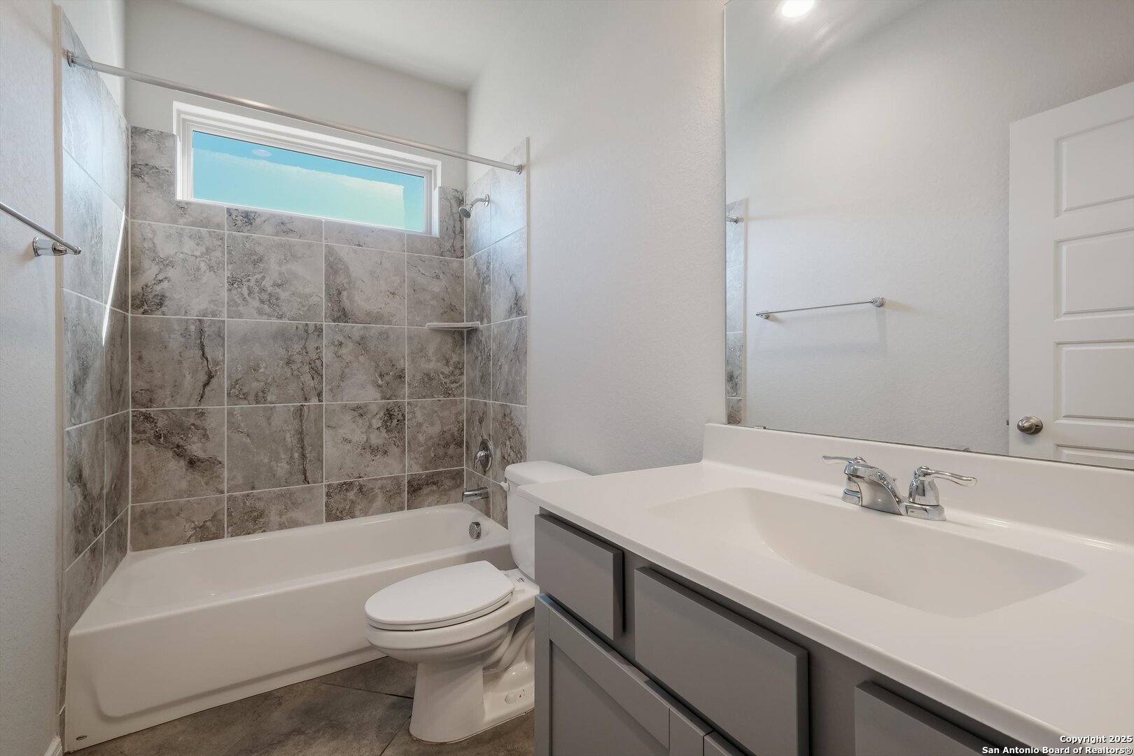 1718 Wind River San Antonio, TX 78258 - Photo 6 of 32 a bathroom with a sink a toilet and a bathtub