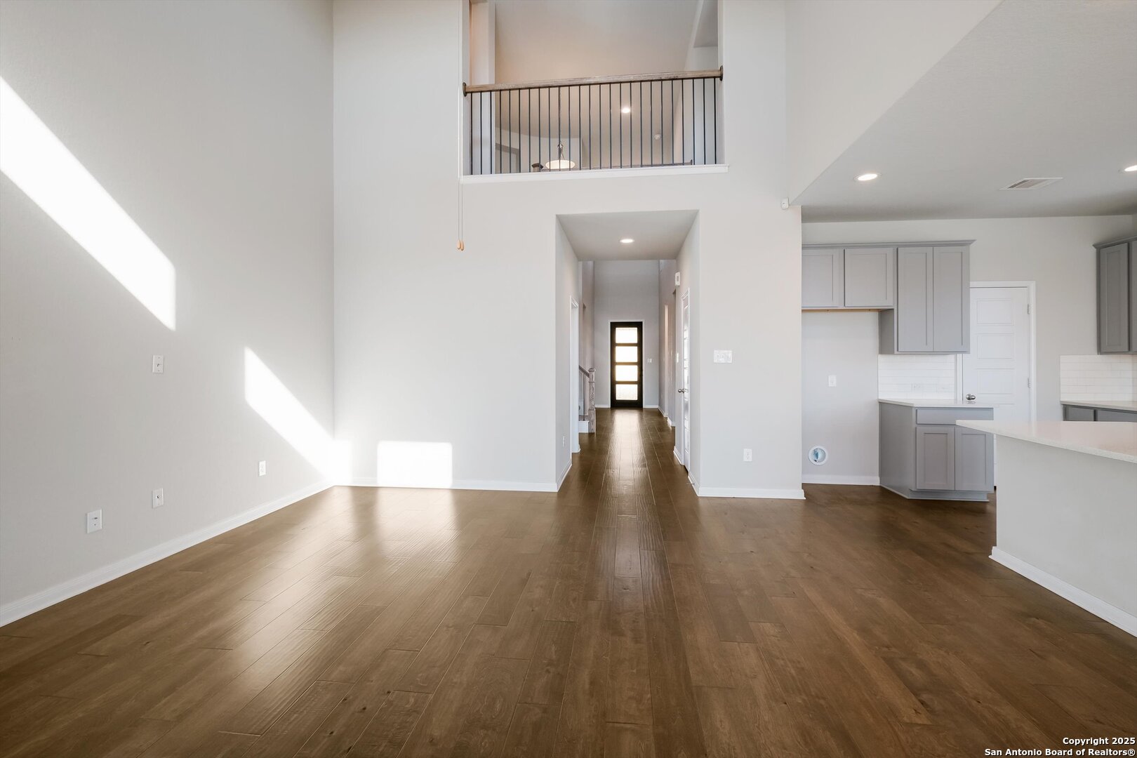 1718 Wind River San Antonio, TX 78258 - Photo 10 of 32 a view of a kitchen with wooden floor and a sink
