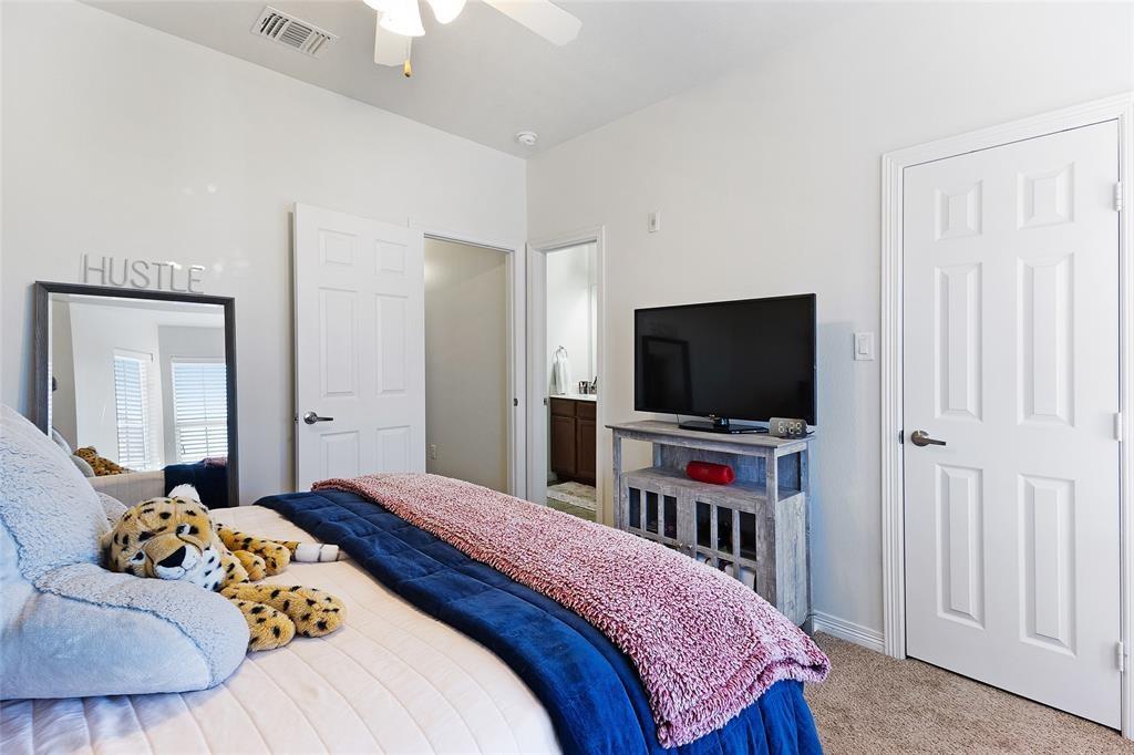 1198 Jones-Butler Road, Unit 2708 College Station, TX 77840 - Photo 14 of 22 a bedroom with a bed and a flat screen tv