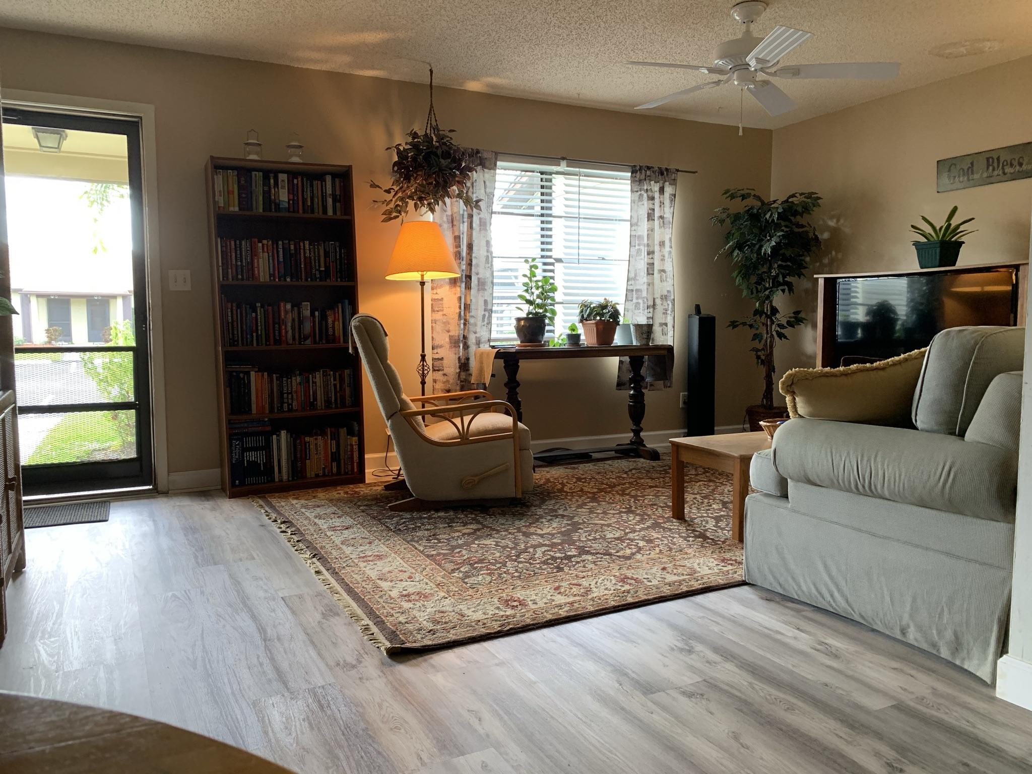 6036 Indrio Road, Unit R3 Fort Pierce, FL 34951 - Photo 3 of 24 a living room with furniture and a window