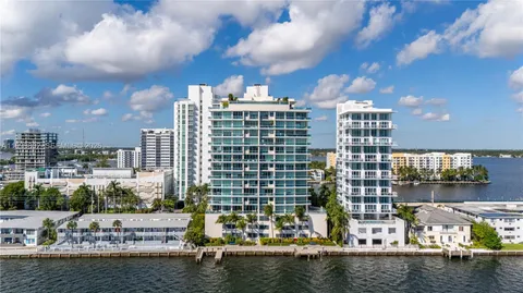 a view of a lake with tall buildings