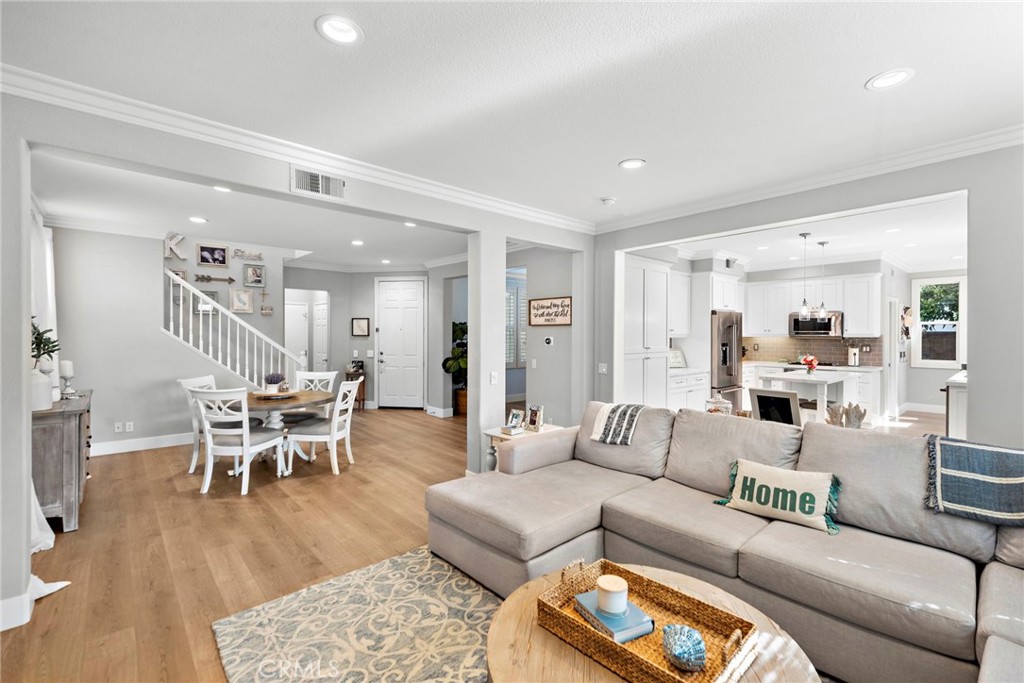 29 Tisbury Way Ladera Ranch, CA 92694 - Photo 1 of 1 a living room with furniture wooden floor and a view of kitchen