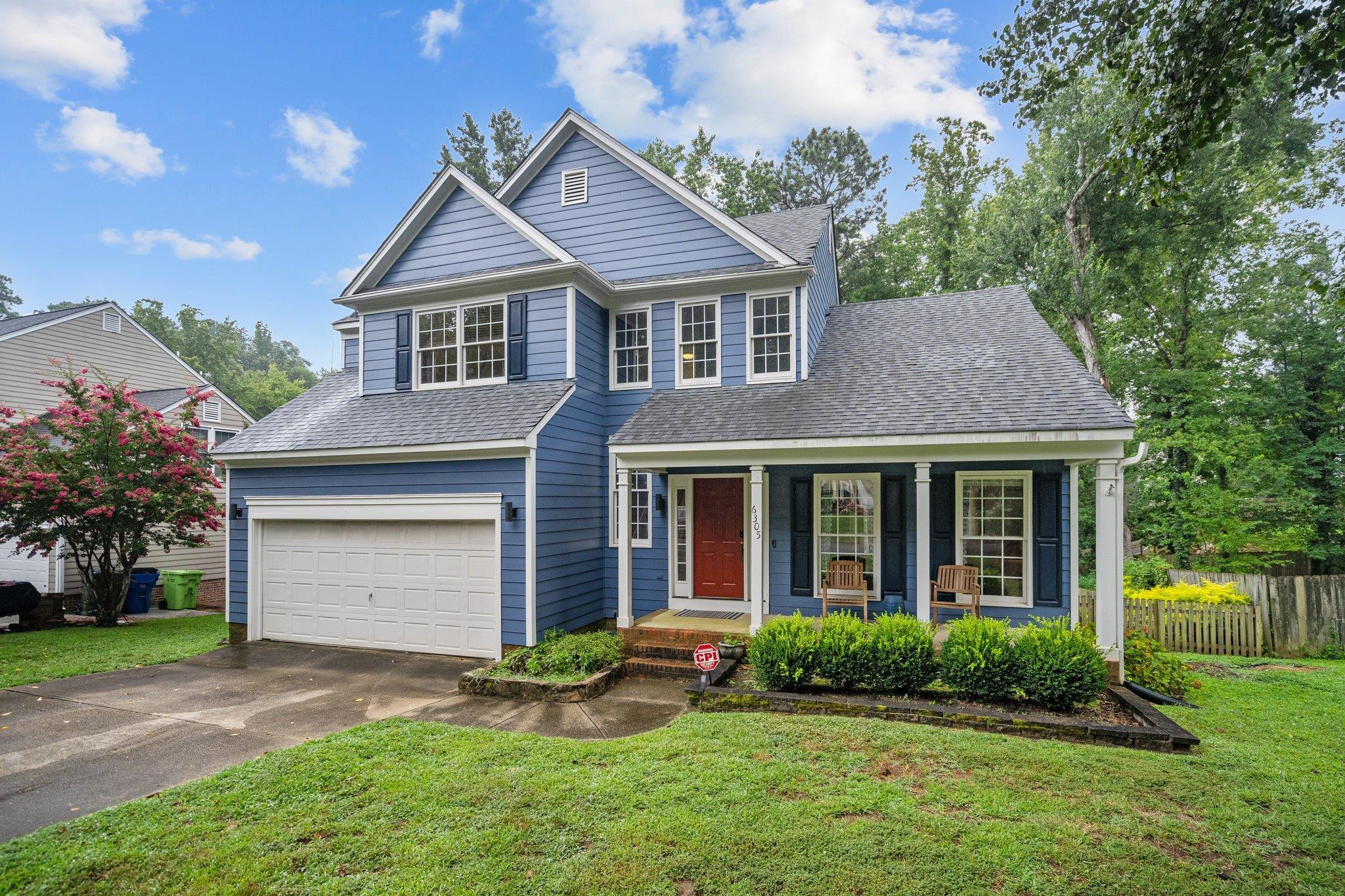 6305 Dry Fork Lane Raleigh, NC 27617 - Photo 1 of 41 a front view of a house with a yard and garage