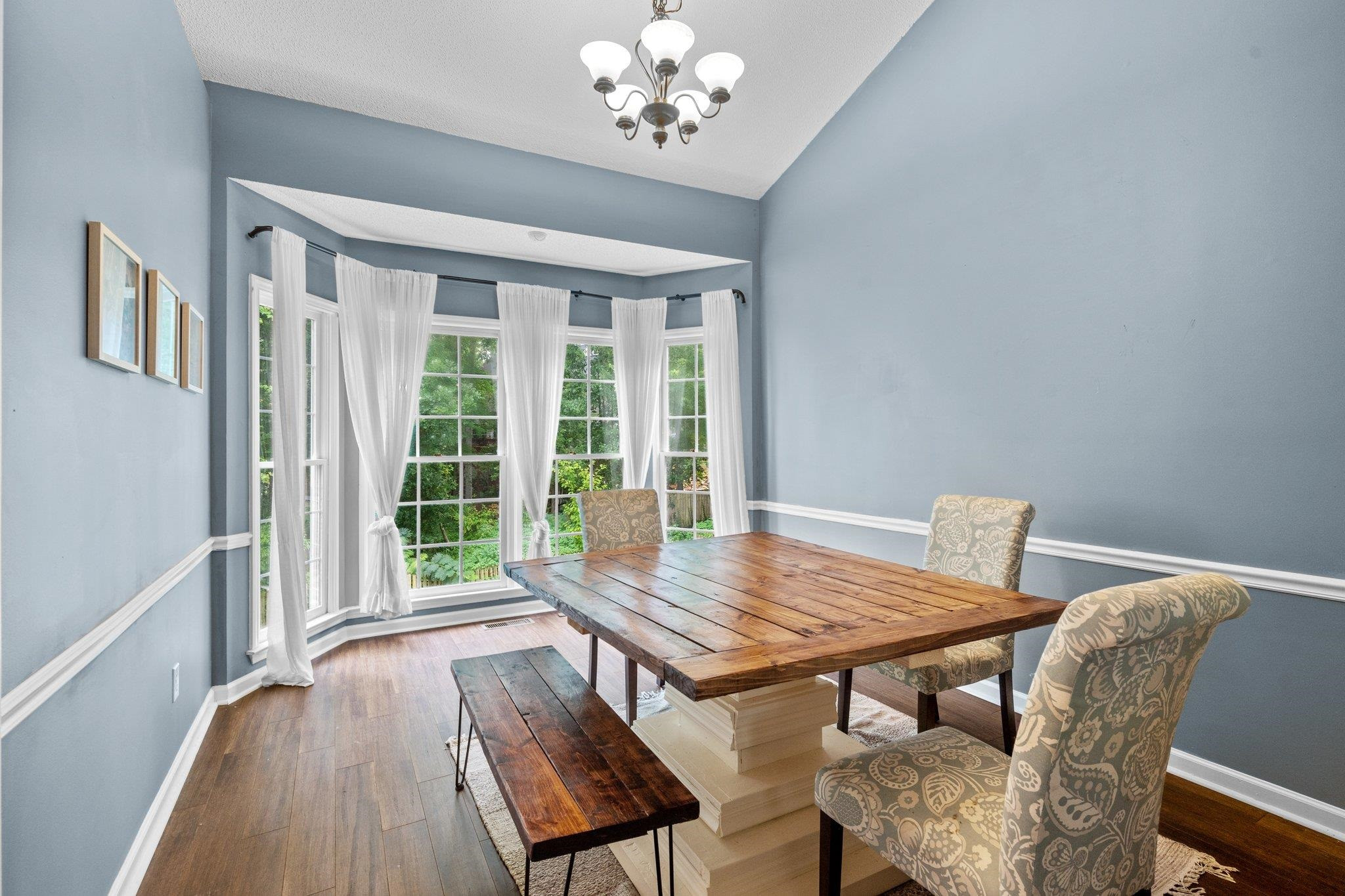 6305 Dry Fork Lane Raleigh, NC 27617 - Photo 11 of 41 a view of a dining room with furniture window and wooden floor