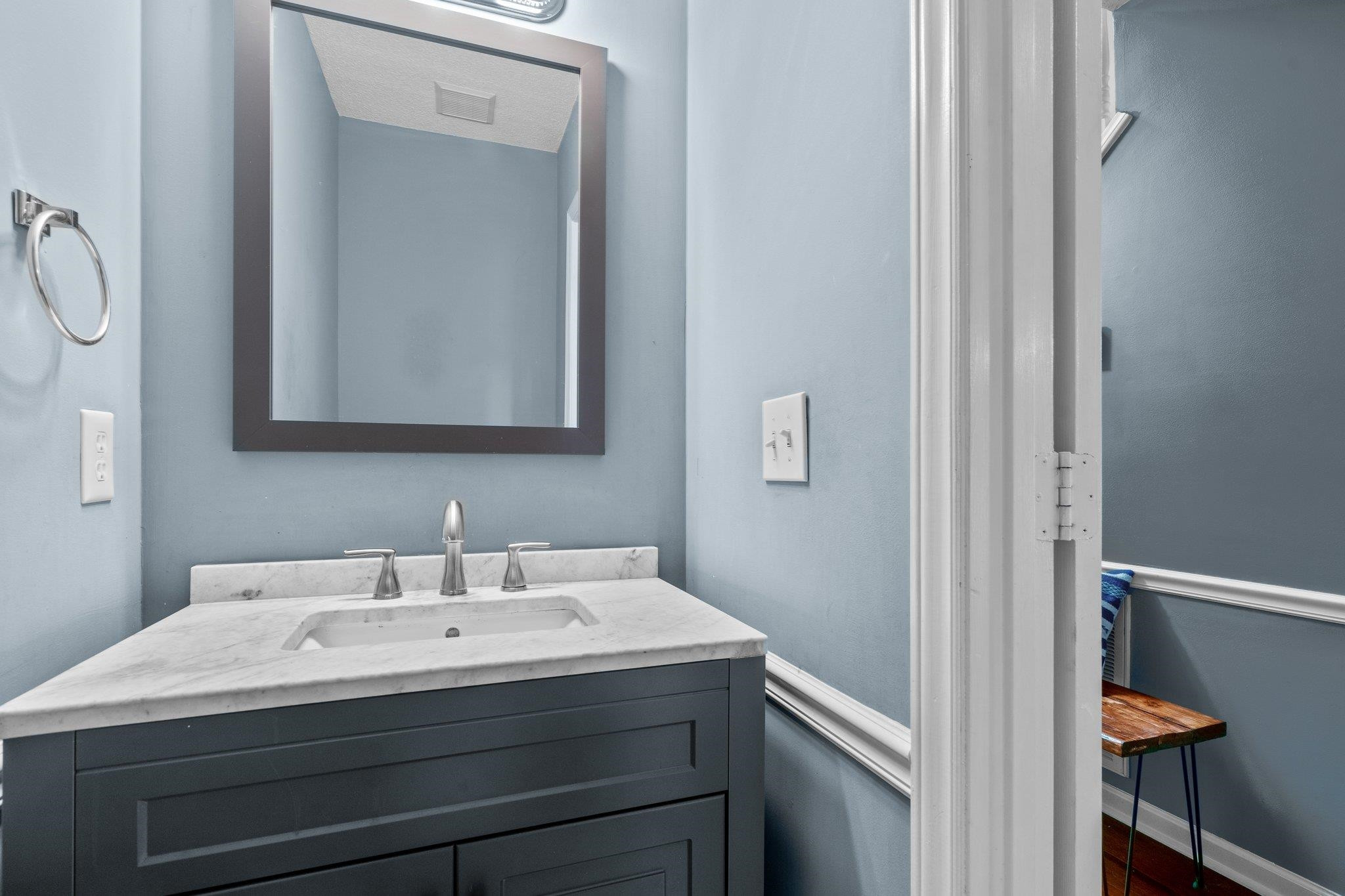 6305 Dry Fork Lane Raleigh, NC 27617 - Photo 16 of 41 a bathroom with a sink and a mirror