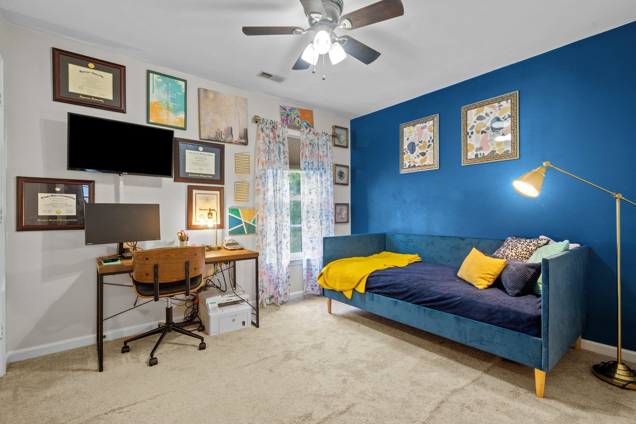 6305 Dry Fork Lane Raleigh, NC 27617 - Photo 18 of 41 a living room with furniture and a flat screen tv