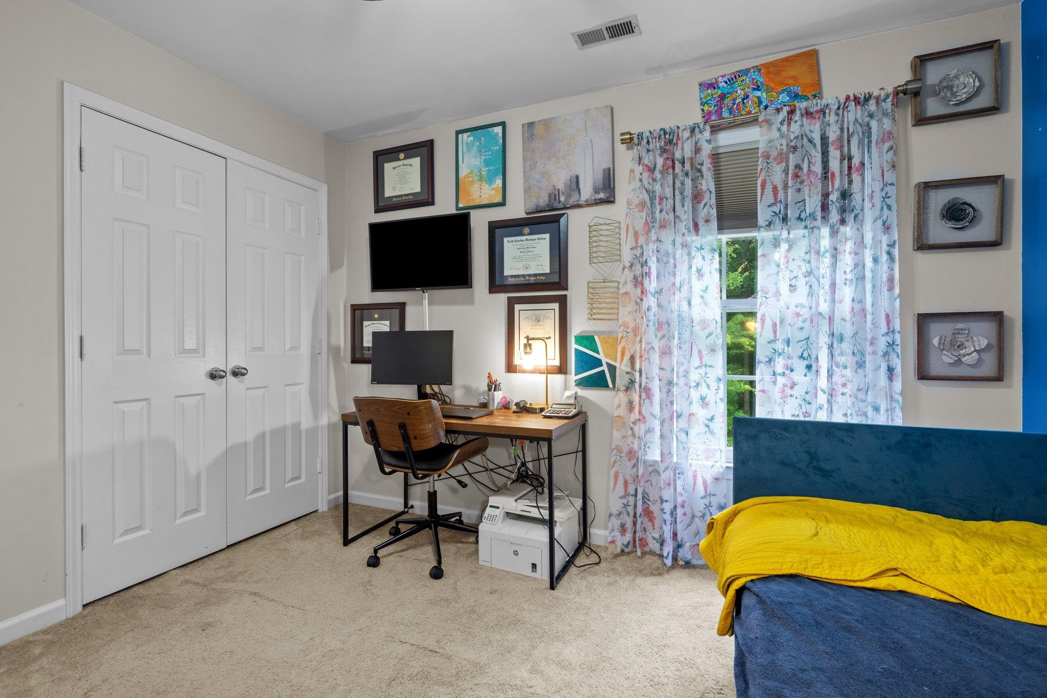 6305 Dry Fork Lane Raleigh, NC 27617 - Photo 19 of 41 a workspace with a couch and a flat screen tv