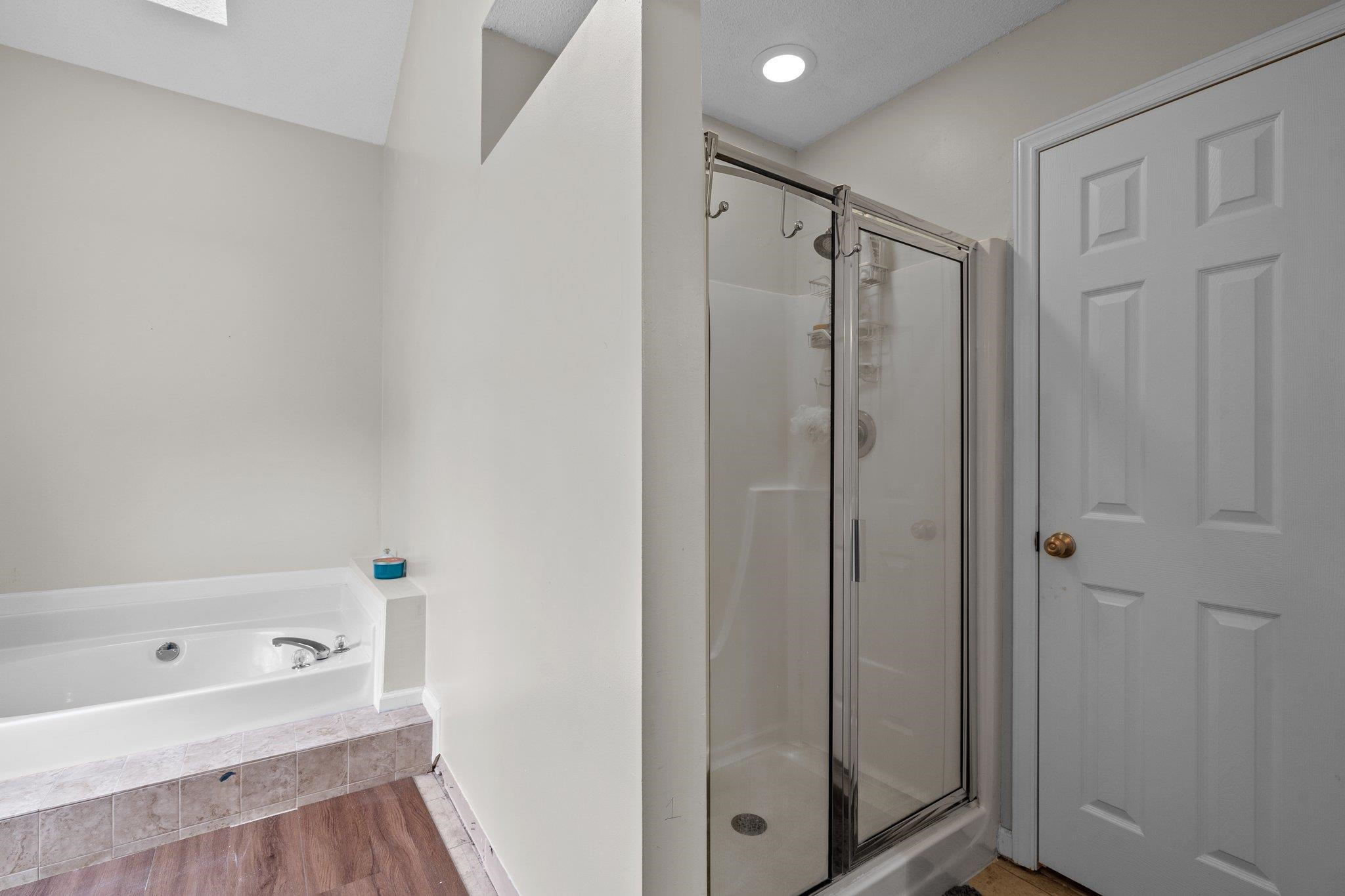 6305 Dry Fork Lane Raleigh, NC 27617 - Photo 24 of 41 a bathroom with a shower and a tub