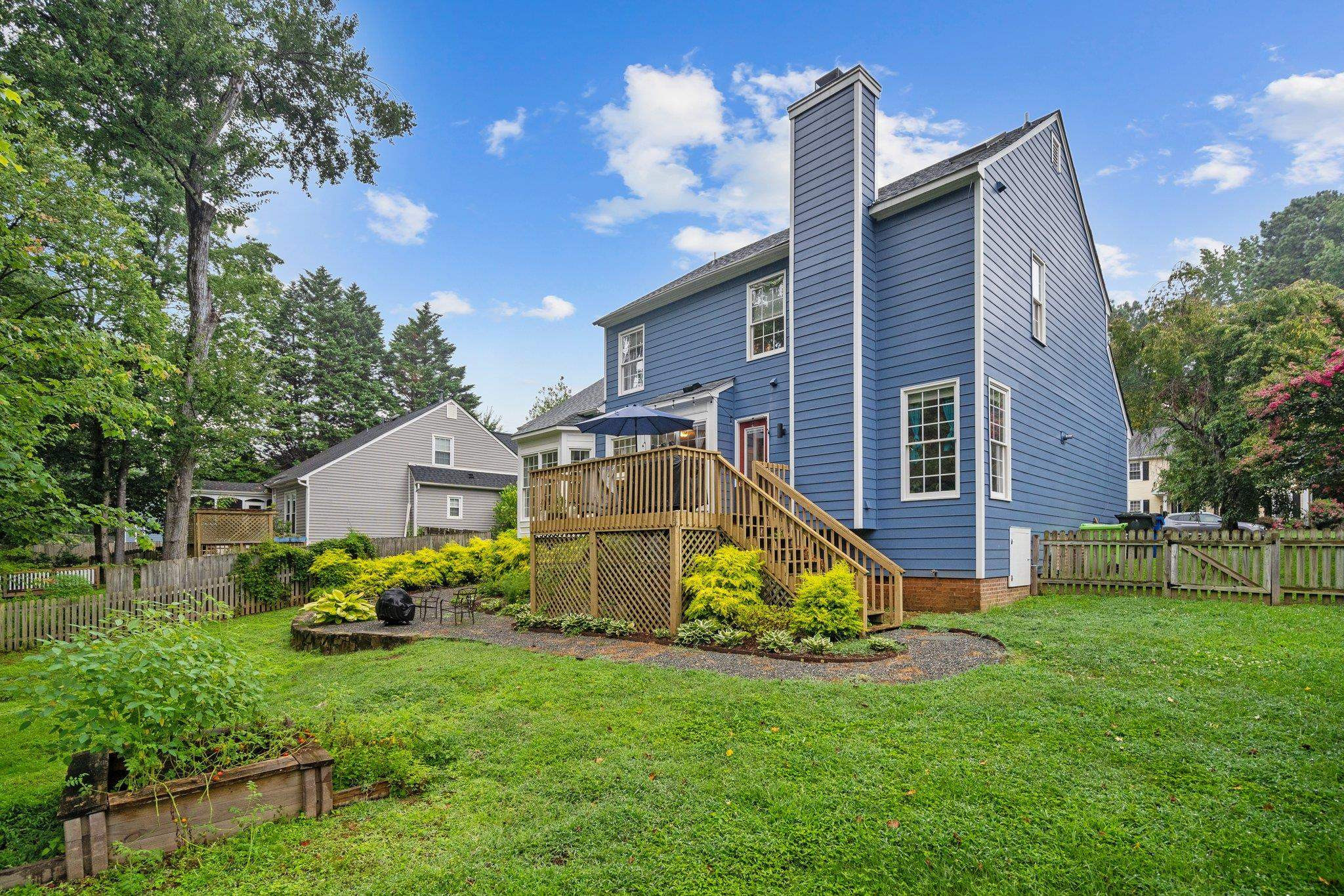 6305 Dry Fork Lane Raleigh, NC 27617 - Photo 33 of 41 a view of a house with a big yard and potted plants