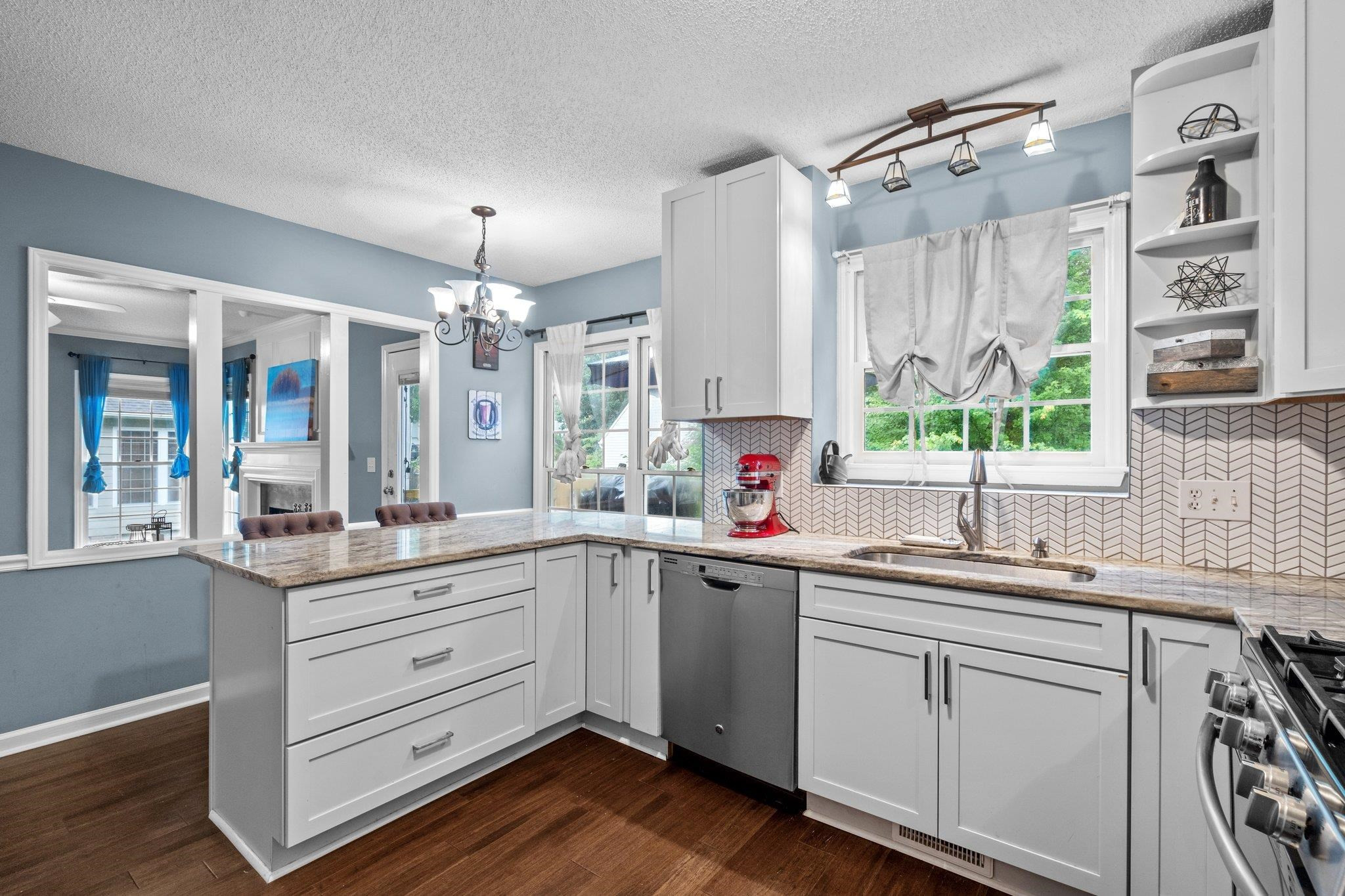 6305 Dry Fork Lane Raleigh, NC 27617 - Photo 4 of 41 a kitchen with a sink stove and cabinets