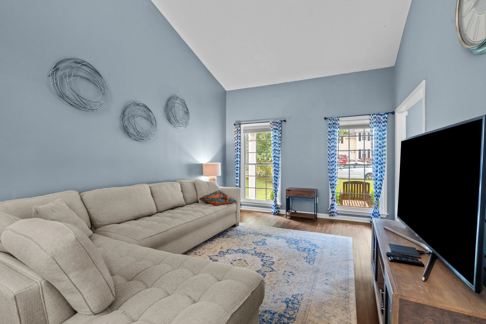 6305 Dry Fork Lane Raleigh, NC 27617 - Photo 9 of 41 a living room with furniture a flat screen tv and a fireplace